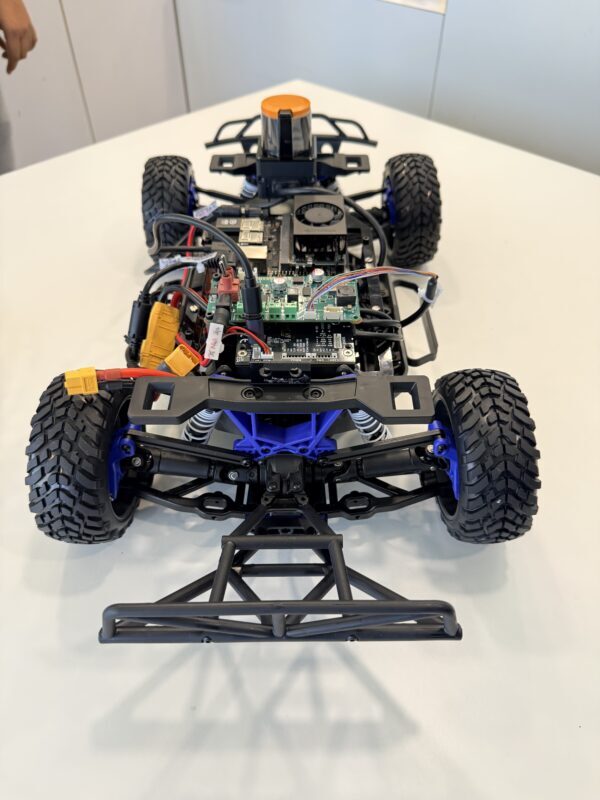 Assembled RoboRacer Core Kit: a 1:10-scale racing chassis carrying a LiDAR unit, Jetson compute module, VESC motor controller and power distribution board.